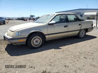 1990 Mercury Sable z VIN 1MECM50U6LG650642, wystawiony jako Copart lot #68279364 z przebiegiem 77 204 mil mil oraz Tytuł czysty. Historia ofert i sprzedaży dostępna na DreamBid. Obrazek 1.
