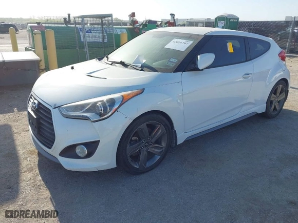 2015 Hyundai Veloster Turbo with VIN KMHTC6AE5FU228008, listed as a IAAI auction lot 42016707 with 122,507 mi miles. Bid and sale history available at carsss.com. Image 2.
