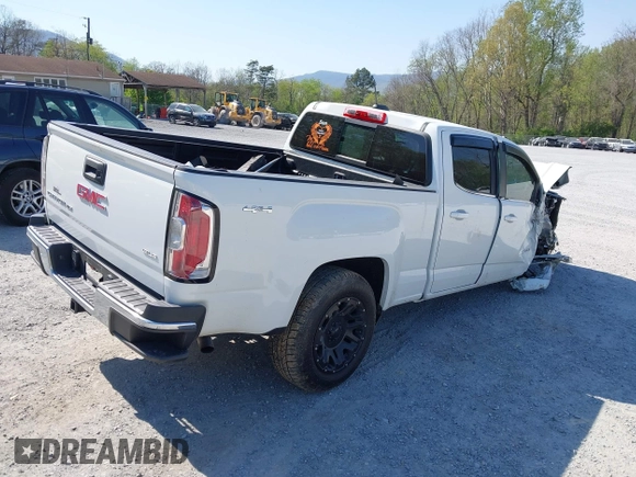 2019 GMC Canyon 4WD SLE z VIN 1GTG6CEN0K1353094, wystawiony jako IAAI lot #42065160 z przebiegiem 73 235 mil mil oraz . Historia ofert i sprzedaży dostępna na DreamBid. Obrazek 4.