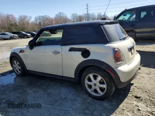 2008 MINI Hardtop with VIN WMWMF33508TT66699, listed as a Copart auction lot 48233985 with 88,817 mi miles and Salvage Title. Bid and sale history available at DreamBid. Image 2.