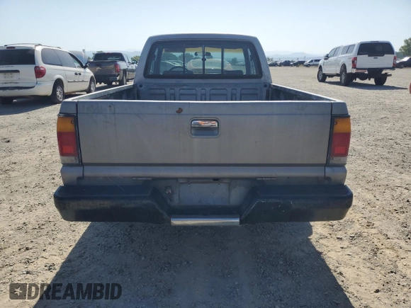1993 Mazda B-Series Truck z VIN JM2UF3130P0378304, wystawiony jako Copart lot #58799925 z przebiegiem 132 801 mil mil oraz Szkoda całkowita • Salvage title. Historia ofert i sprzedaży dostępna na DreamBid. Obrazek 6.