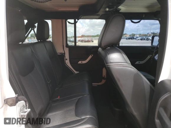 2015 Jeep Wrangler Unlimited Wrangler X with VIN 1C4BJWEG6FL614671, listed as a Copart auction lot 62286095 with 94,928 mi miles and Salvage title. Bid and sale history available at DreamBid. Image 11.