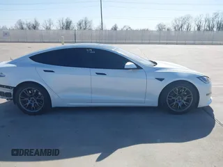2022 Tesla Model S Plaid with VIN 5YJSA1E69NF486471, listed as a IAAI auction lot 41228818 with 49,207 mi miles and . Bid and sale history available at carsss.com. Image 13.