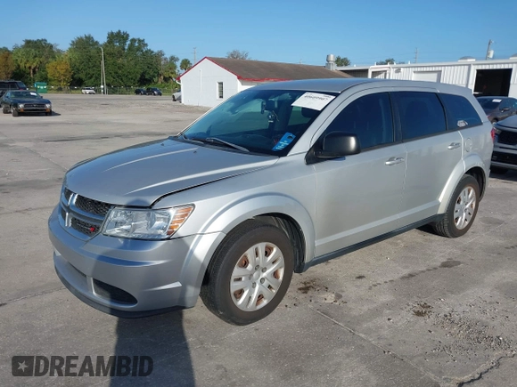 2014 Dodge Journey SE with VIN 3C4PDCAB0ET221998, listed as a IAAI auction lot 40609907 with 203,241 mi miles and . Bid and sale history available at carsss.com. Image 2.