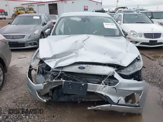 2019 Ford Fusion S with VIN 3FA6P0G71KR275393, listed as a IAAI auction lot 41827288 with 108,160 mi miles and . Bid and sale history available at DreamBid. Image 12.