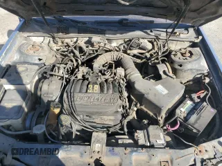 1990 Ford Taurus z VIN 1FACP5747LA124012, wystawiony jako Copart lot #85290054 z przebiegiem 118 017 mil mil oraz Czysty tytuł • Clean title. Historia ofert i sprzedaży dostępna na DreamBid. Obrazek 11.