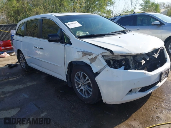 2012 Honda Odyssey EX-L with VIN 5FNRL5H62CB010054, listed as a IAAI auction lot 42040117 with 189,566 mi miles and . Bid and sale history available at carsss.com. Image 1.