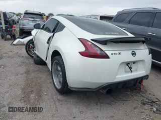 2016 Nissan 370Z Sport z VIN JN1AZ4EH1GM930883, wystawiony jako IAAI lot #41909945 z przebiegiem 80 484 mil mil oraz . Historia ofert i sprzedaży dostępna na DreamBid. Obrazek 3.