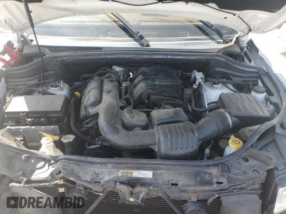 2015 Jeep Grand Cherokee Summit with VIN 1C4RJFJG3FC847797, listed as a Copart auction lot 54848085 with 53,506 mi miles and Salvage Title. Bid and sale history available at DreamBid. Image 12.