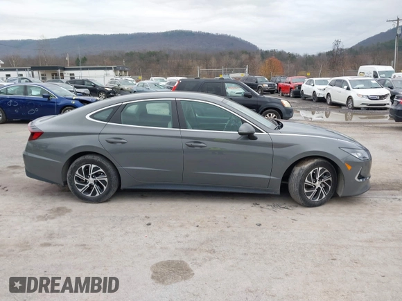 2022 Hyundai Sonata Hybrid Blue with VIN KMHL24JJ2NA048439, listed as a IAAI auction lot 40942477 with 64,855 mi miles. Bid and sale history available at carsss.com. Image 14.