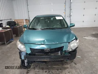 2010 Toyota Corolla z VIN 2T1BU4EE2AC517770, wystawiony jako IAAI lot #40742010 z przebiegiem 152 224 mil mil oraz . Historia ofert i sprzedaży dostępna na DreamBid. Obrazek 12.
