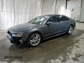 2015 Audi A8 z VIN WAUJGAFDXFN008499, wystawiony jako Copart lot #87658385 z przebiegiem 103 175 mil mil oraz Szkoda całkowita • Salvage title. Historia ofert i sprzedaży dostępna na DreamBid. Obrazek 1.