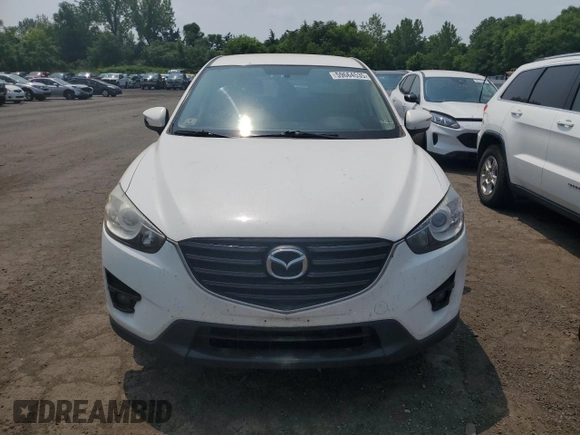 2016 Mazda CX-5 Touring z VIN JM3KE4CY1G0820270, wystawiony jako Copart lot #59664535 z przebiegiem 129 709 mil mil oraz Czysty tytuł • Clean title. Historia ofert i sprzedaży dostępna na DreamBid. Obrazek 5.