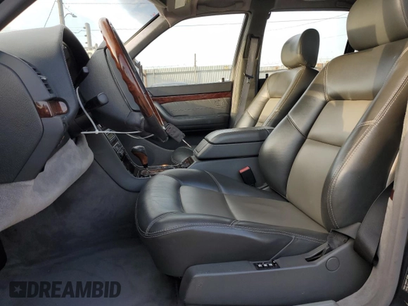1999 Mercedes-Benz S with VIN WDBGA57G5XA428158, listed as a Copart auction lot 65543515 with 65,698 mi miles and Salvage title. Bid and sale history available at DreamBid. Image 7.