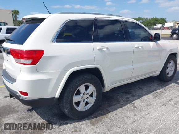 2011 Jeep Grand Cherokee Laredo with VIN 1J4RS4GG0BC573388, listed as a IAAI auction lot 42167064 with 63,363 mi miles and . Bid and sale history available at DreamBid. Image 4.