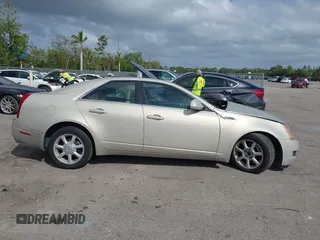 2008 Cadillac CTS AWD z VIN 1G6DG577280155483, wystawiony jako IAAI lot #41723609 z przebiegiem 132 756 mil mil oraz . Historia ofert i sprzedaży dostępna na DreamBid. Obrazek 13.