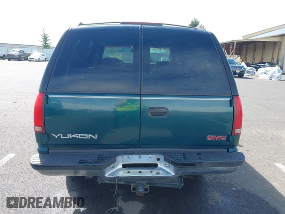 1999 GMC Yukon with VIN 1GKEK13R3XJ717999, listed as a IAAI auction lot 41870187 with 179,855 mi miles. Bid and sale history available at carsss.com. Image 16.