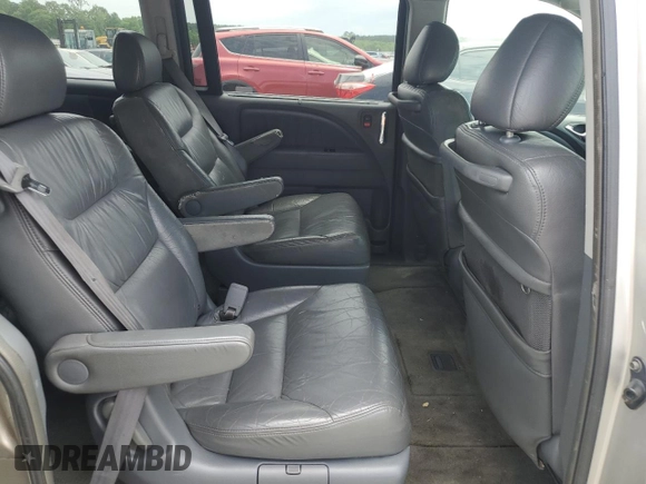 2006 Honda Odyssey Touring z VIN 5FNRL38886B000011, wystawiony jako Copart lot #57399225 z przebiegiem 256 217 mil mil oraz Szkoda całkowita • Salvage title. Historia ofert i sprzedaży dostępna na DreamBid. Obrazek 11.