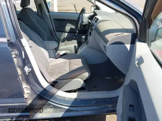 2007 Dodge Caliber SXT with VIN 1B3HB48B77D108825, listed as a IAAI auction lot 42096558 with 144,978 mi miles and . Bid and sale history available at DreamBid. Image 5.