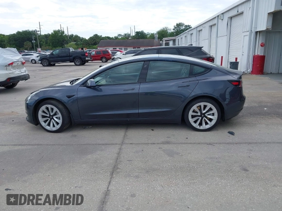 2021 Tesla Model 3 Long Range with VIN 5YJ3E1EB4MF855581, listed as a IAAI auction lot 41974515 with 71,561 mi miles. Bid and sale history available at carsss.com. Image 14.