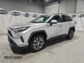 2022 Toyota RAV4 Hybrid XLE Premium z VIN 4T3B6RFV1NU080099, wystawiony jako Copart lot #60206905 z przebiegiem 59 859 mil mil oraz Czysty tytuł • Clean title. Historia ofert i sprzedaży dostępna na DreamBid. Obrazek 1.