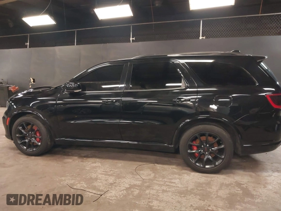 2023 Dodge Durango R/T Plus with VIN 1C4SDJCT8PC571642, listed as a IAAI auction lot 42093743 with 33,631 mi miles and . Bid and sale history available at DreamBid. Image 14.