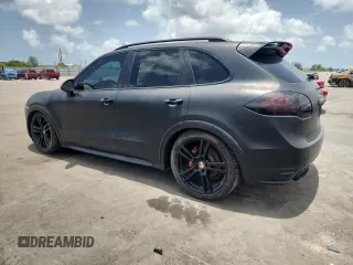 2014 Porsche Cayenne GTS z VIN WP1AD2A28ELA74131, wystawiony jako Copart lot #60239115 z przebiegiem Nie podano mil oraz Czysty tytuł • Clean title. Historia ofert i sprzedaży dostępna na DreamBid. Obrazek 2.