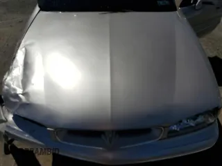 1998 Pontiac Bonneville SE z VIN 1G2HX52K0W4238012, wystawiony jako Copart lot #70997824 z przebiegiem 146 825 mil mil oraz Szkody całkowita. Historia ofert i sprzedaży dostępna na DreamBid. Obrazek 11.