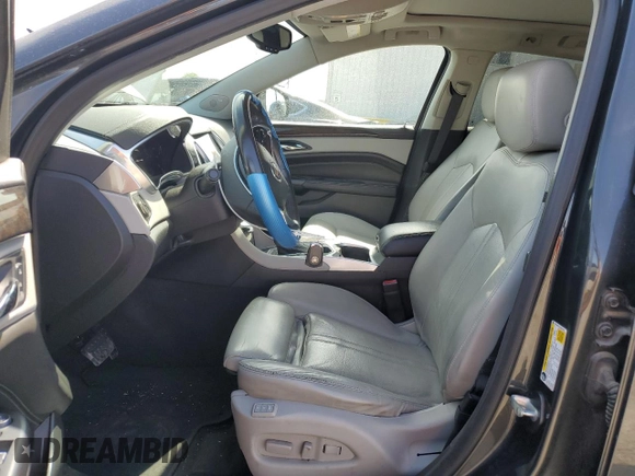 2015 Cadillac SRX Luxury Collection z VIN 3GYFNBE34FS541817, wystawiony jako Copart lot #58386685 z przebiegiem 51 731 mil mil oraz Szkoda całkowita • Salvage title. Historia ofert i sprzedaży dostępna na DreamBid. Obrazek 7.