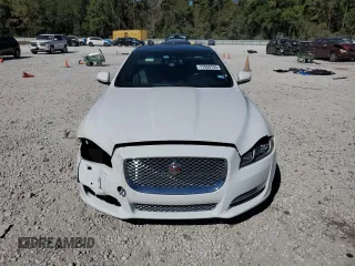 2016 Jaguar XJ Portfolio with VIN SAJWA2G79G8W00955, listed as a Copart auction lot 77650194 with 60,515 mi miles and Clean title. Bid and sale history available at DreamBid. Image 5.