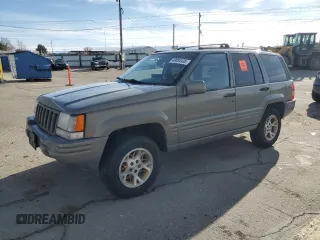 1997 Jeep Grand Cherokee Limited with VIN 1J4GZ78Y4VC754624, listed as a Copart auction lot 49884435 with 144,682 mi miles and Salvage Title. Bid and sale history available at carsss.com. Image 1.