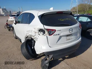 2014 Mazda CX-5 Sport with VIN JM3KE2BE8E0301175, listed as a IAAI auction lot 42051972 with 121,821 mi miles and . Bid and sale history available at carsss.com. Image 3.