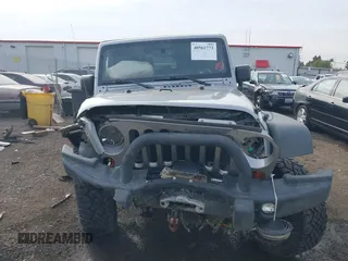 2013 Jeep Wrangler Rubicon 10th Anniversary with VIN 1C4BJWCG8DL639121, listed as a IAAI auction lot 40561773 with 56,023 mi miles and . Bid and sale history available at DreamBid. Image 12.