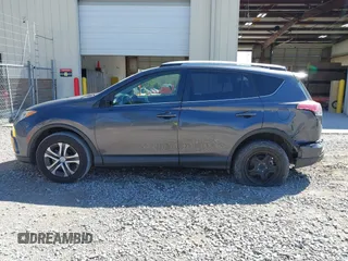 2016 Toyota RAV4 LE with VIN JTMZFREV5GJ078051, listed as a IAAI auction lot 41858381 with 97,032 mi miles and . Bid and sale history available at DreamBid. Image 14.