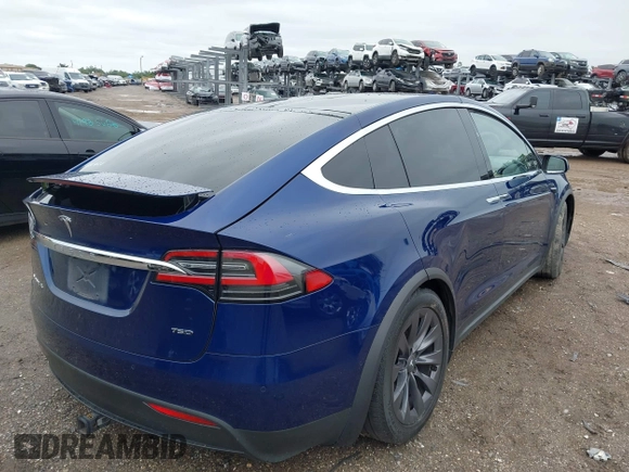 2018 Tesla Model X 75D with VIN 5YJXCAE2XJF111180, listed as a IAAI auction lot 41988079 with 114,593 mi miles and . Bid and sale history available at DreamBid. Image 4.