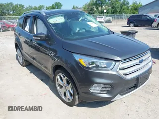 2019 Ford Escape Titanium z VIN 1FMCU9J94KUC24611, wystawiony jako IAAI lot #42595286 z przebiegiem 77 280 mil mil oraz . Historia ofert i sprzedaży dostępna na DreamBid. Obrazek 1.