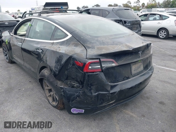 2019 Tesla Model 3 Mid Range with VIN 5YJ3E1EA2KF362048, listed as a IAAI auction lot 40141734 with 70,321 mi miles and . Bid and sale history available at carsss.com. Image 6.