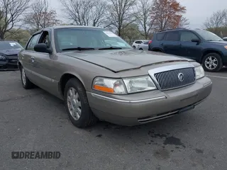 2003 Mercury Grand Marquis LS Premium z VIN 2MEFM75W73X653224, wystawiony jako IAAI lot #42038256 z przebiegiem 145 374 mil mil oraz . Historia ofert i sprzedaży dostępna na DreamBid. Obrazek 1.