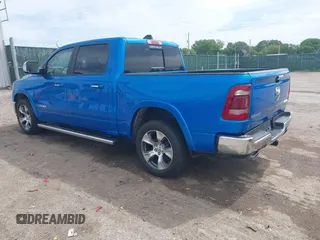2021 Ram 1500 Laramie with VIN 1C6SRFJT1MN774879, listed as a IAAI auction lot 42242318 with 51,971 mi miles and . Bid and sale history available at DreamBid. Image 3.