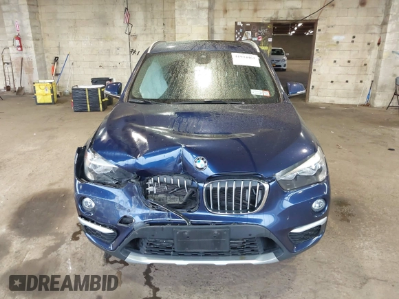 2019 BMW X1 xDrive28i with VIN WBXHT3C55K5L37338, listed as a IAAI auction lot 41934461 with 87,913 mi miles. Bid and sale history available at carsss.com. Image 12.