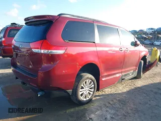2014 Toyota Sienna XLE with VIN 5TDYK3DCXES473671, listed as a IAAI auction lot 42243030 with 70,052 mi miles and . Bid and sale history available at DreamBid. Image 4.