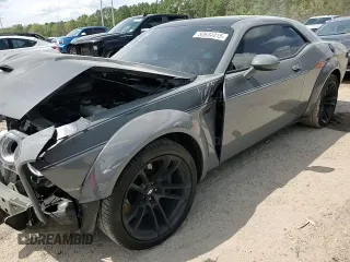 2023 Dodge Challenger R/T Scat Pack Widebody z VIN 2C3CDZFJ2PH694352, wystawiony jako Copart lot #50634415 z przebiegiem 5 340 mil mil oraz Szkoda całkowita • Salvage title. Historia ofert i sprzedaży dostępna na DreamBid. Obrazek 10.