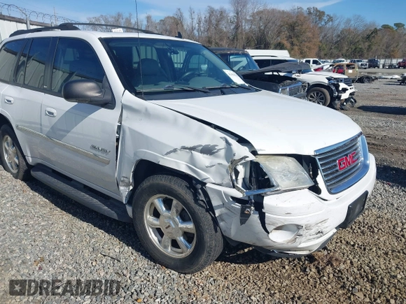 2006 GMC Envoy SLT with VIN 1GKDS13S062128531, listed as a IAAI auction lot 41458983 with 119,385 mi miles. Bid and sale history available at carsss.com. Image 6.