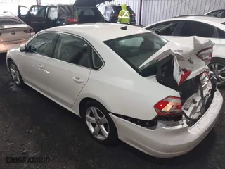 2013 Volkswagen Passat SE w/Sunroof with VIN 1VWBH7A35DC111003, listed as a IAAI auction lot 41991990 with 142,103 mi miles. Bid and sale history available at carsss.com. Image 3.