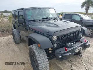 2017 Jeep Wrangler Unlimited Rubicon Recon z VIN 1C4BJWFG0HL505849, wystawiony jako IAAI lot #41359938 z przebiegiem 66 800 mil mil oraz . Historia ofert i sprzedaży dostępna na DreamBid. Obrazek 1.
