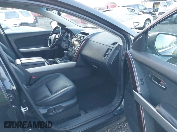 2014 Mazda CX-9 Grand Touring with VIN JM3TB3DV7E0429276, listed as a IAAI auction lot 41415446 with 94,939 mi miles and . Bid and sale history available at DreamBid. Image 5.