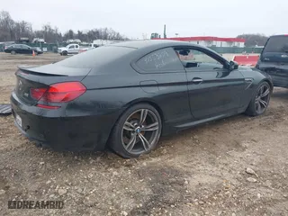 2014 BMW M6 with VIN WBSLX9C58ED160558, listed as a IAAI auction lot 41553209 with 154,789 mi miles. Bid and sale history available at carsss.com. Image 4.