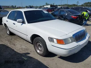 2000 Mercury Grand Marquis LS z VIN 2MEFM75W3YX689323, wystawiony jako IAAI lot #42019687 z przebiegiem 241 045 mil mil oraz . Historia ofert i sprzedaży dostępna na DreamBid. Obrazek 1.