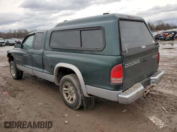 1999 Dodge Dakota SLT with VIN 1B7GG22X4XS309050, listed as a Copart auction lot 82030864 with 141,396 mi miles and Non Repairable. Bid and sale history available at DreamBid. Image 2.