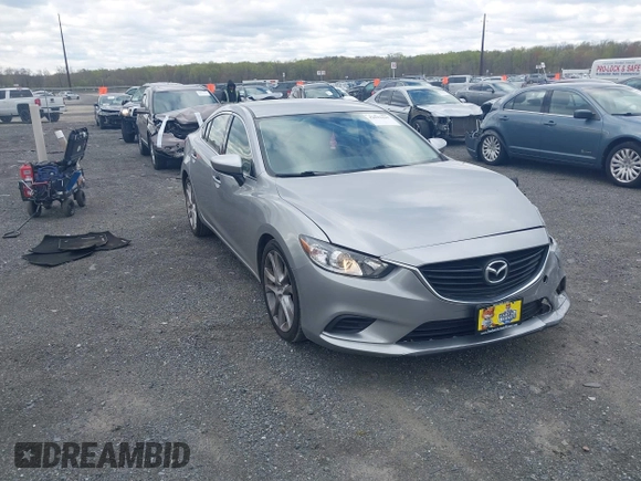 2014 Mazda 6 i Touring with VIN JM1GJ1V64E1147549, listed as a IAAI auction lot 42041025 with 124,400 mi miles and . Bid and sale history available at DreamBid. Image 1.